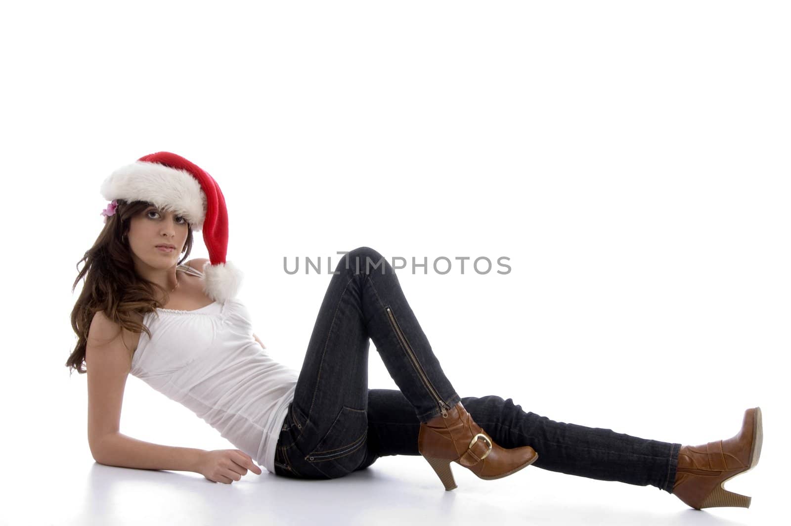 laying glamorous woman with christmas hat on an isolated background