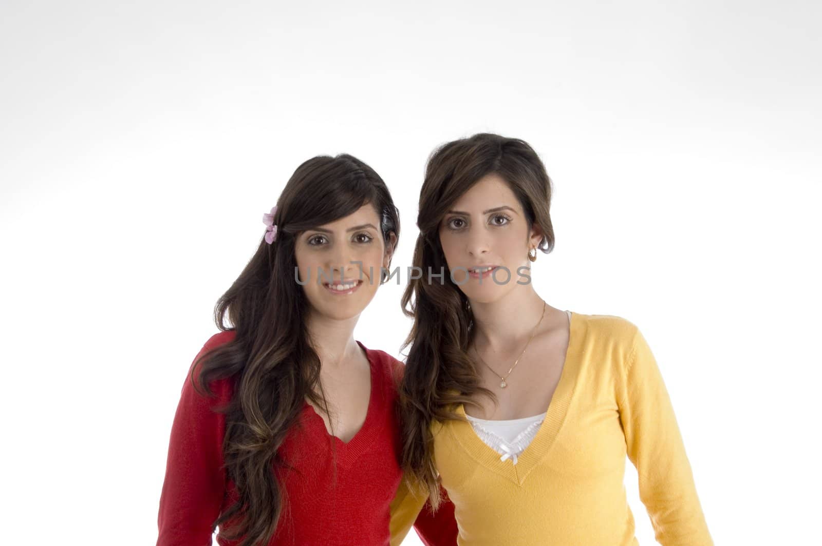 portrait of smiling sisters on an isolated background