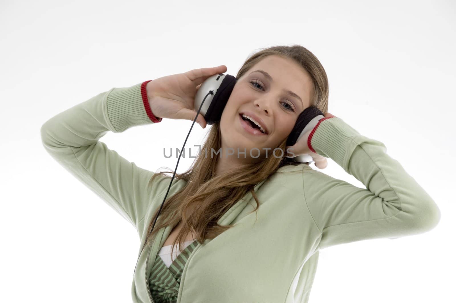 attractive female enjoying music isolated with white background