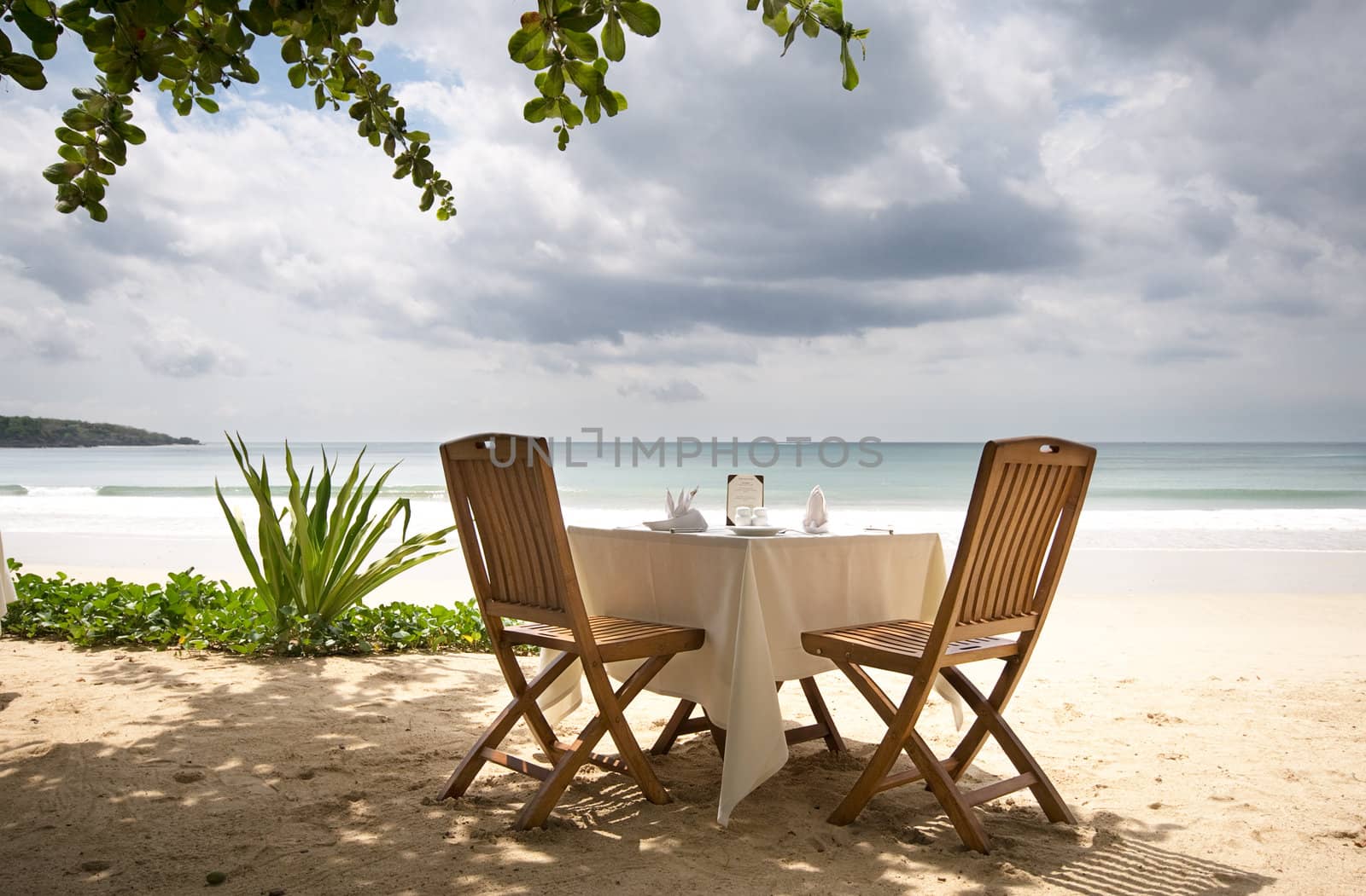 table and chairs on a beach