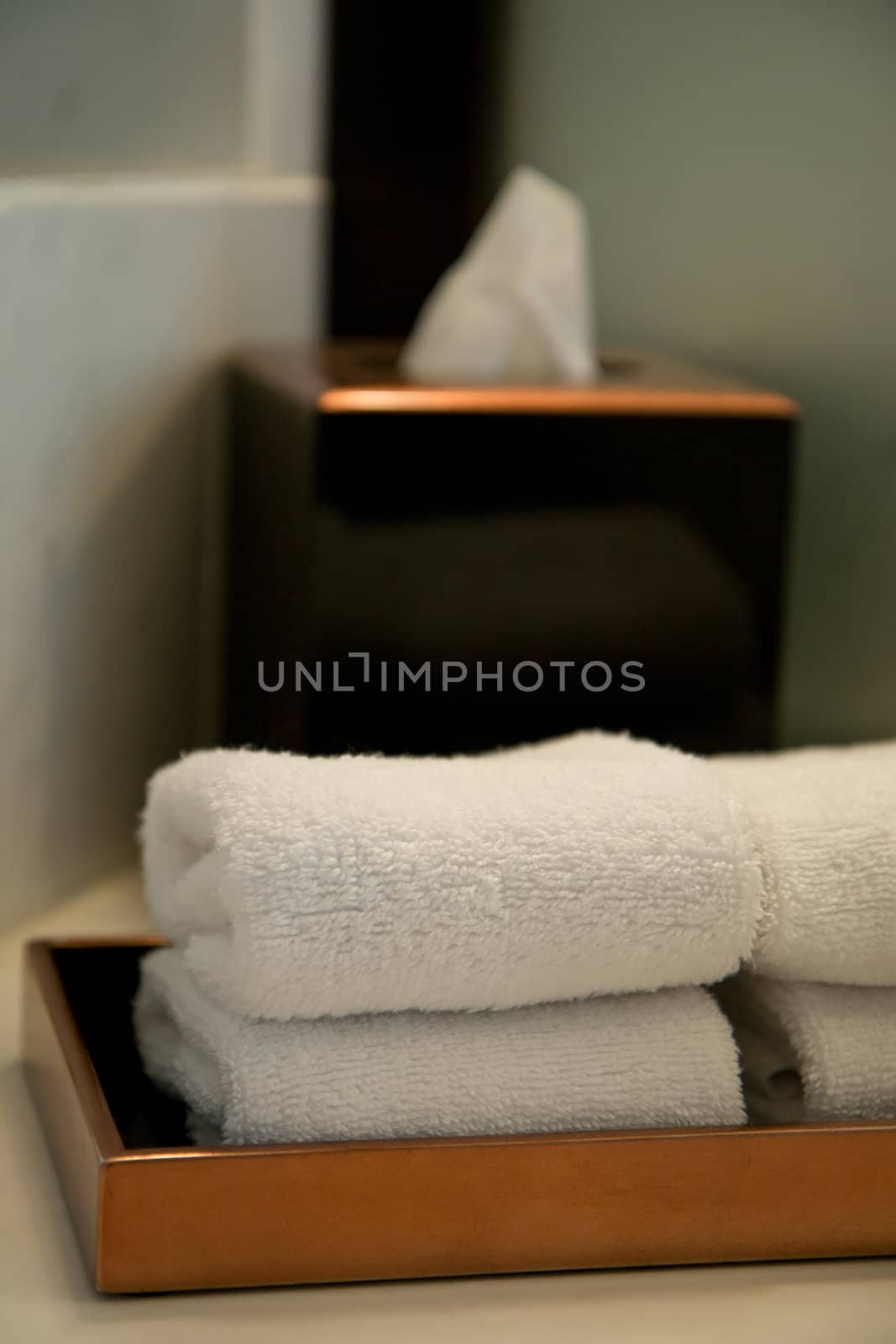 pile of towels in a hotel bathroom by noblige