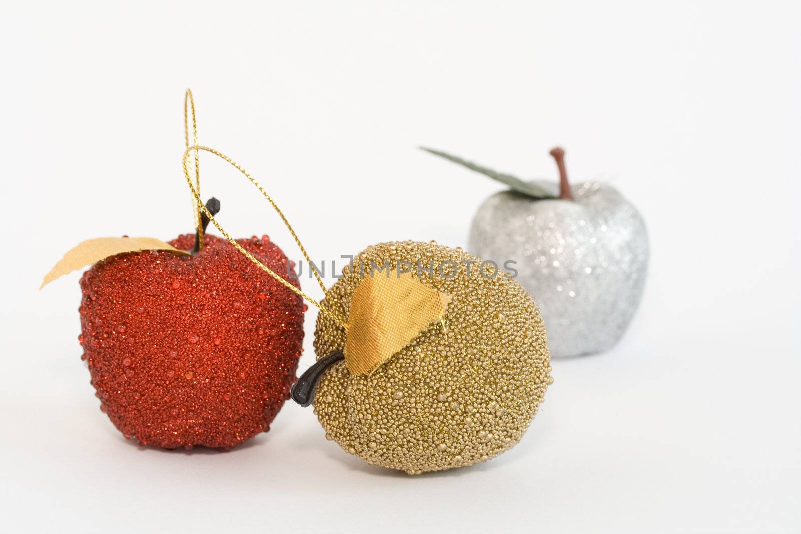Three handicraft apples. Christmas tree decoration