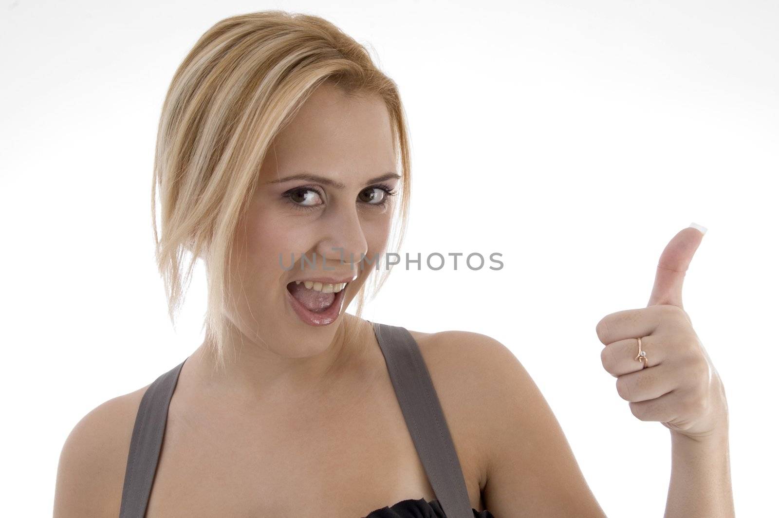 smiling woman showing thumbs up on an isolated white background