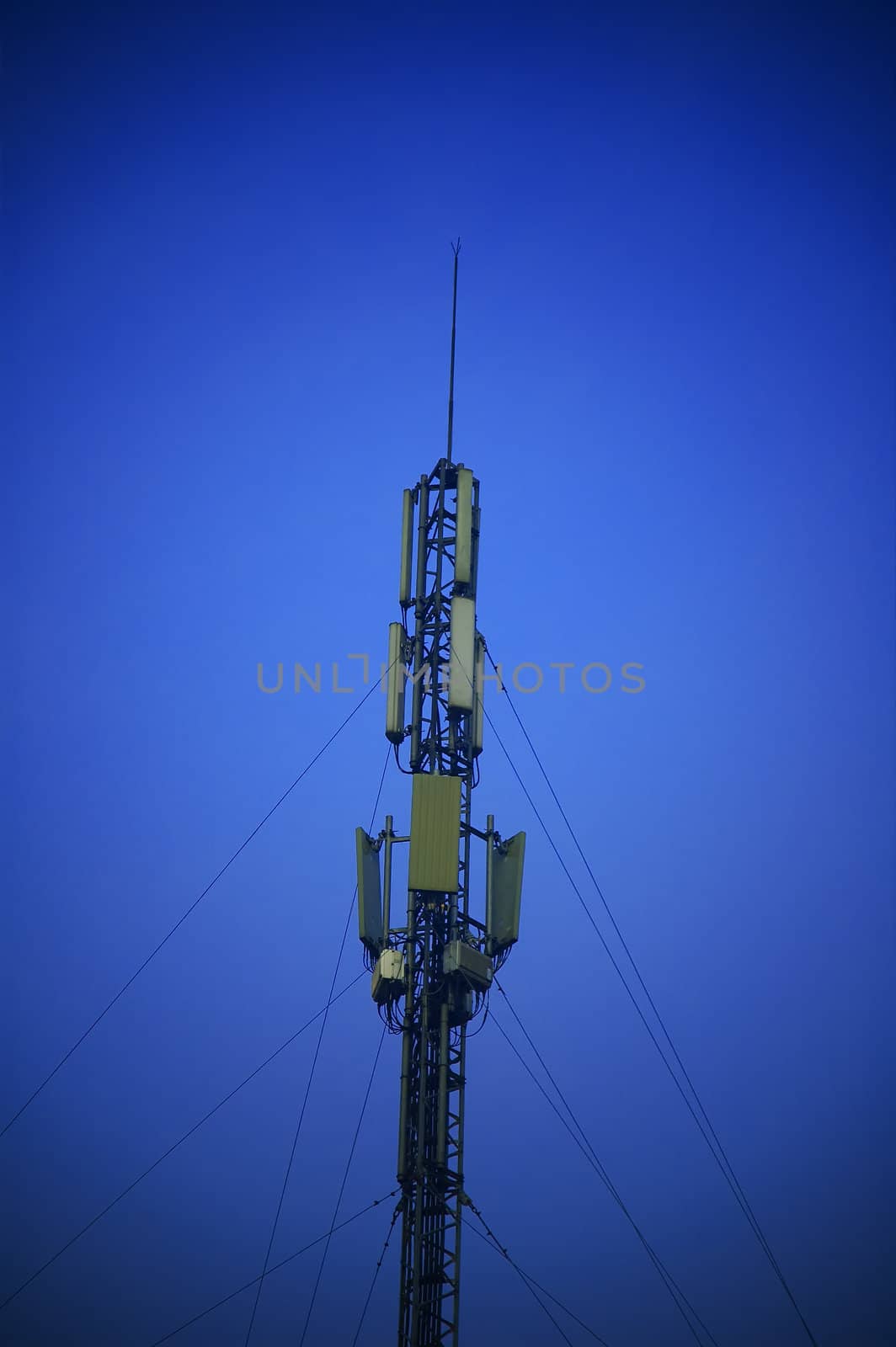 modern telecomunications antenna over a blue sky