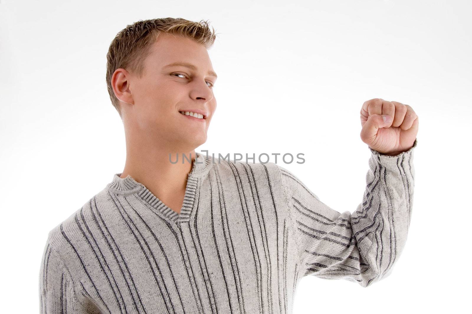 smiling man showing his fist with white background