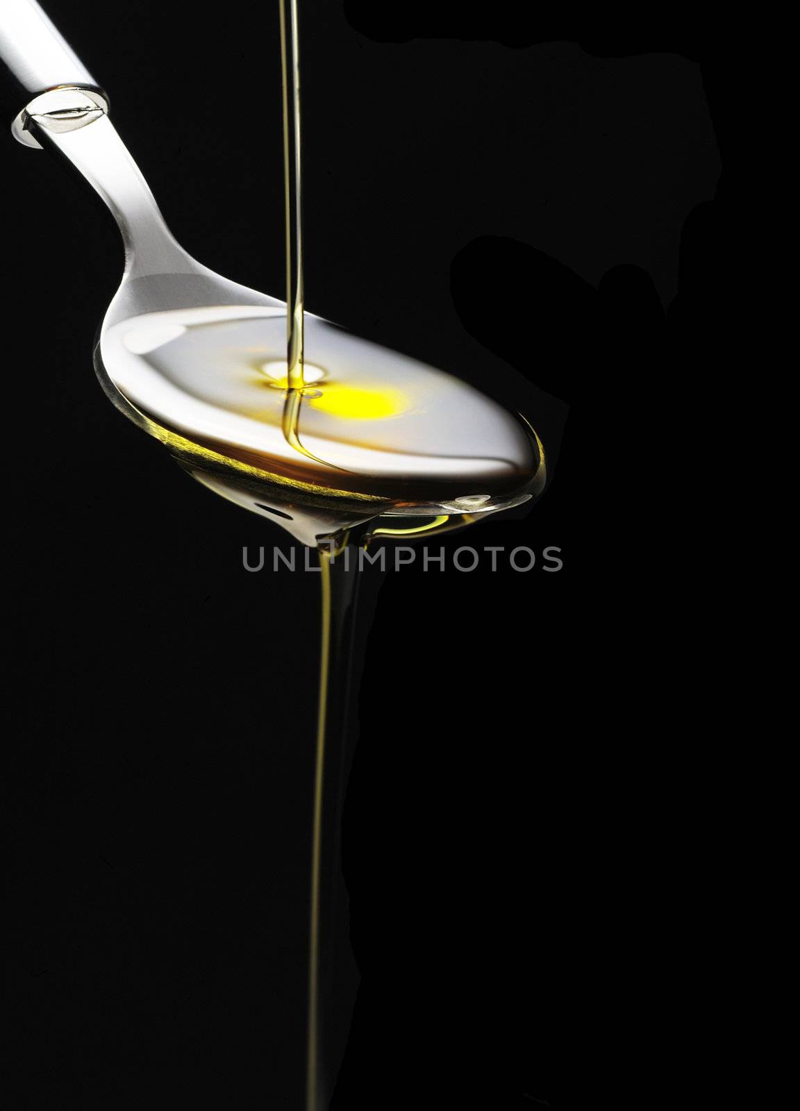 olive oil on a spoon by keko64