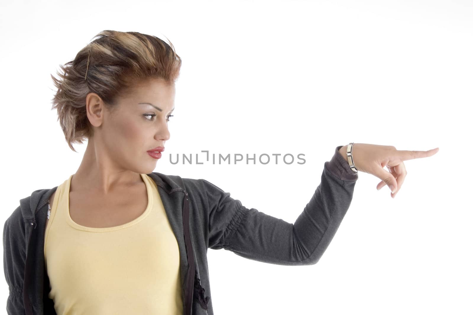 attractive woman indicating side against white background