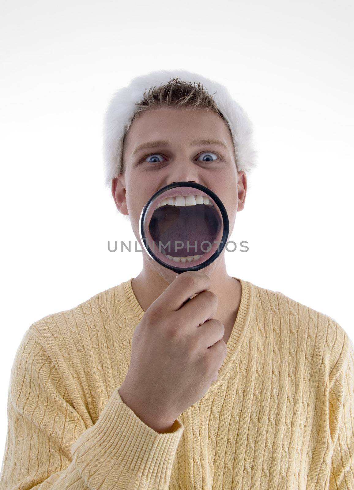 man weaing santa hat and showing teeth through lens on an isolated background