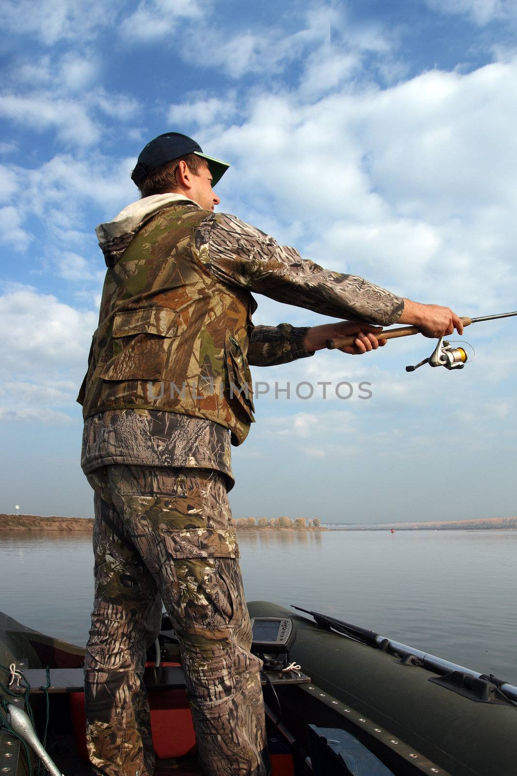 man fishing with spinning on the river