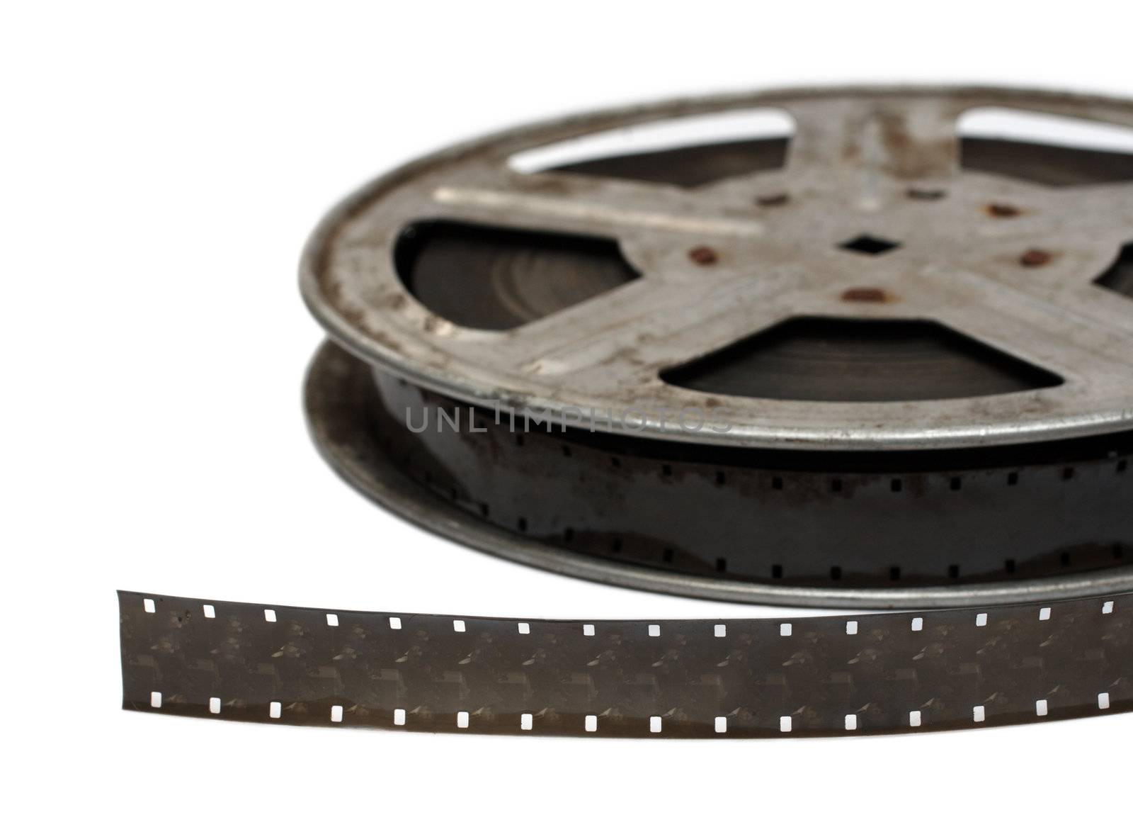 old movie film on metal reel close-up by Mikko