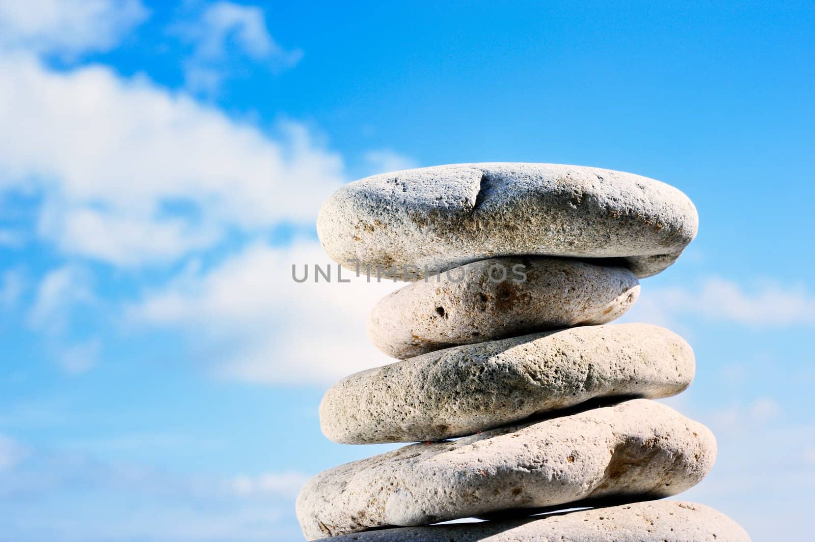 Pile of stones against the sky with clouds