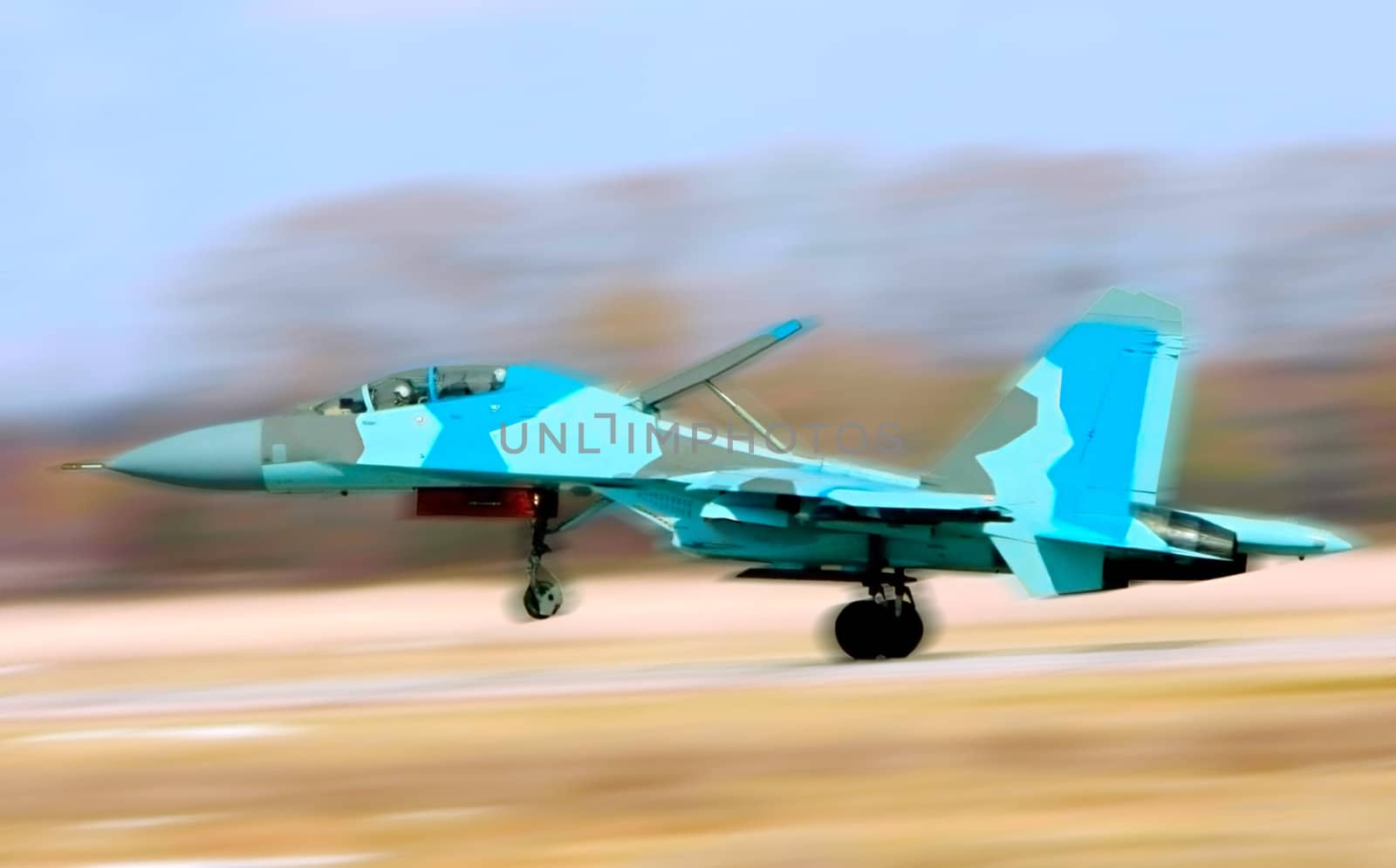 Fighter Su-34 take-off from a airdrome. Panning effect