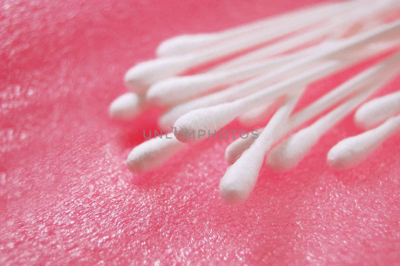 cotton hygiene sticks over pink