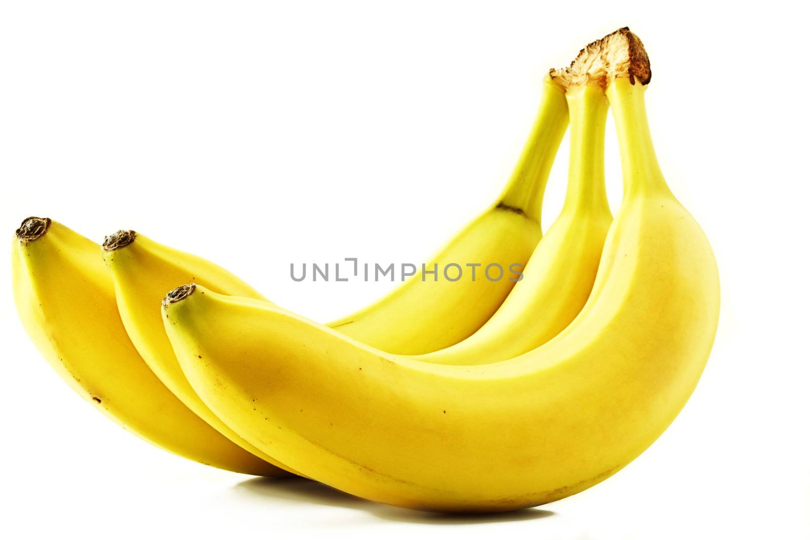 three yellow bananas on white background