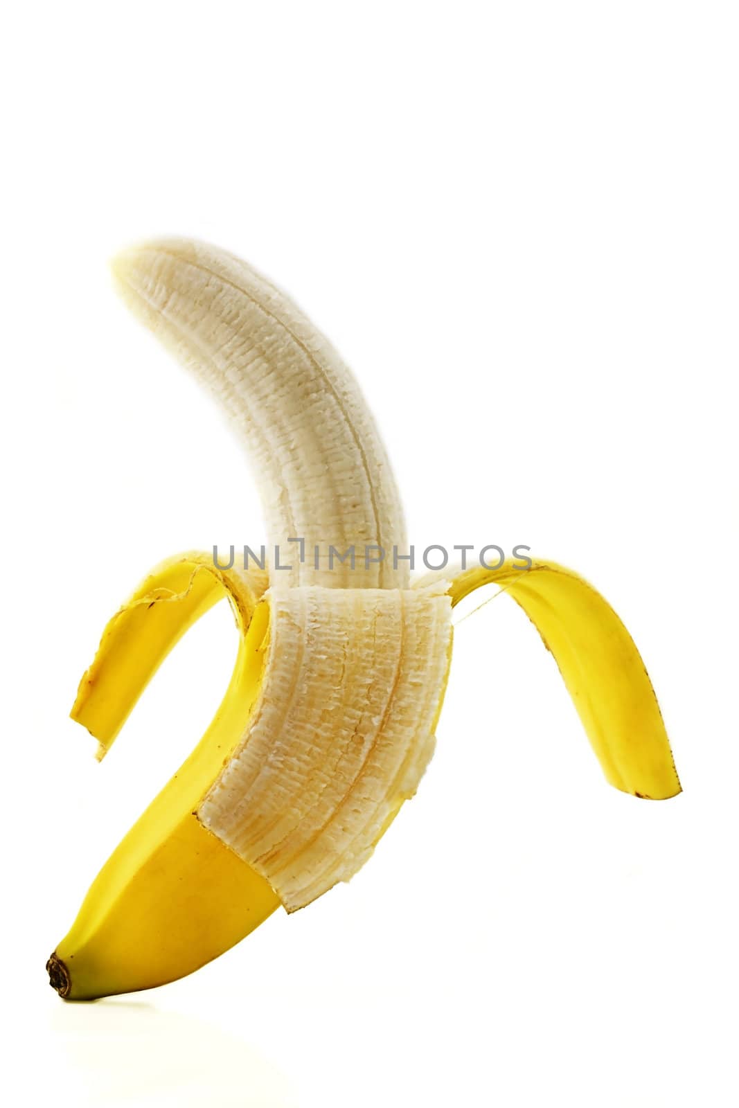 one peeled standing banana on white background