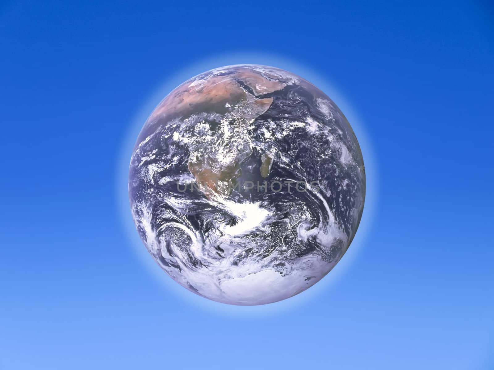 The Earth over a clear blue sky backdrop