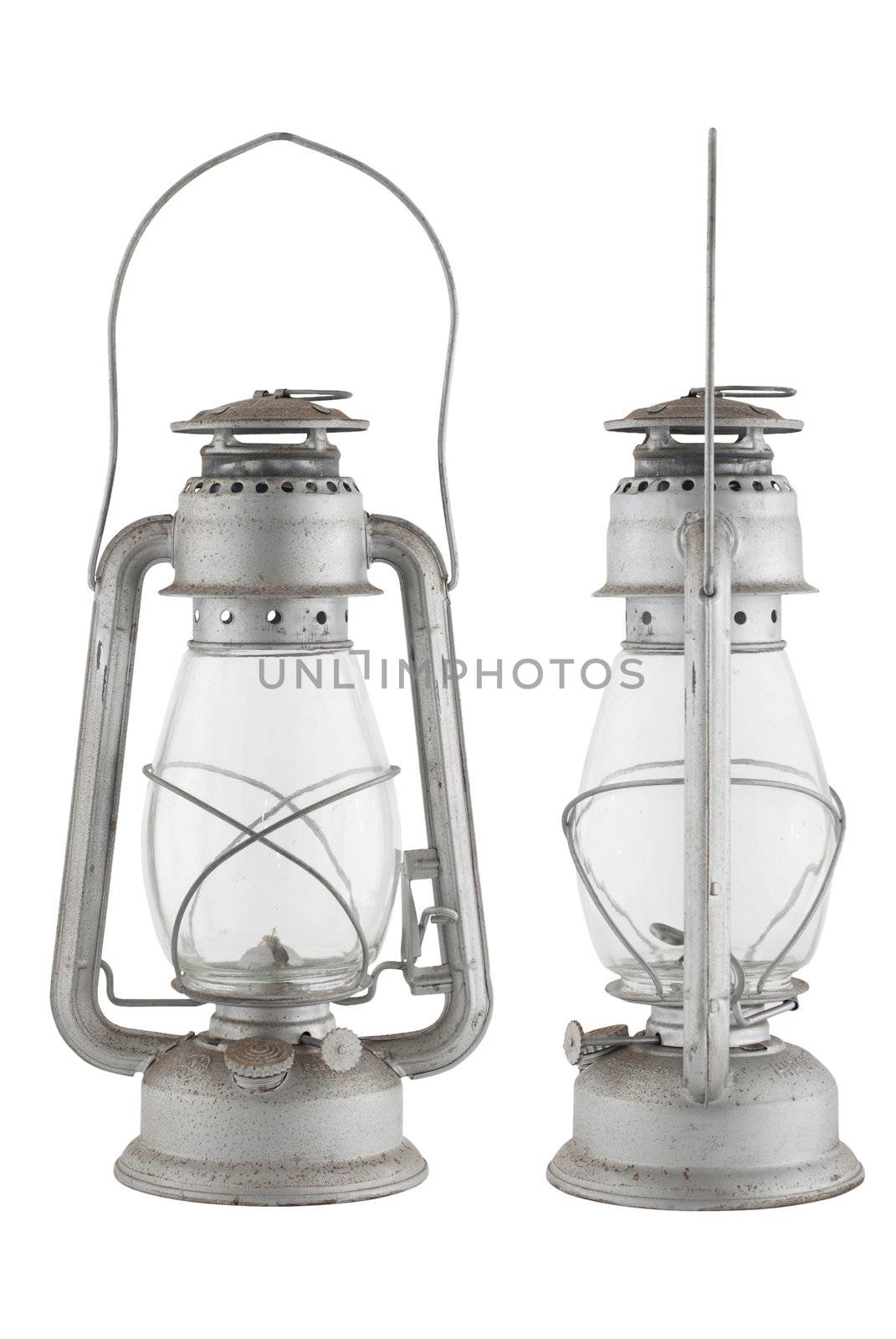 Old oil lamp isolated of the background and in diferent views.