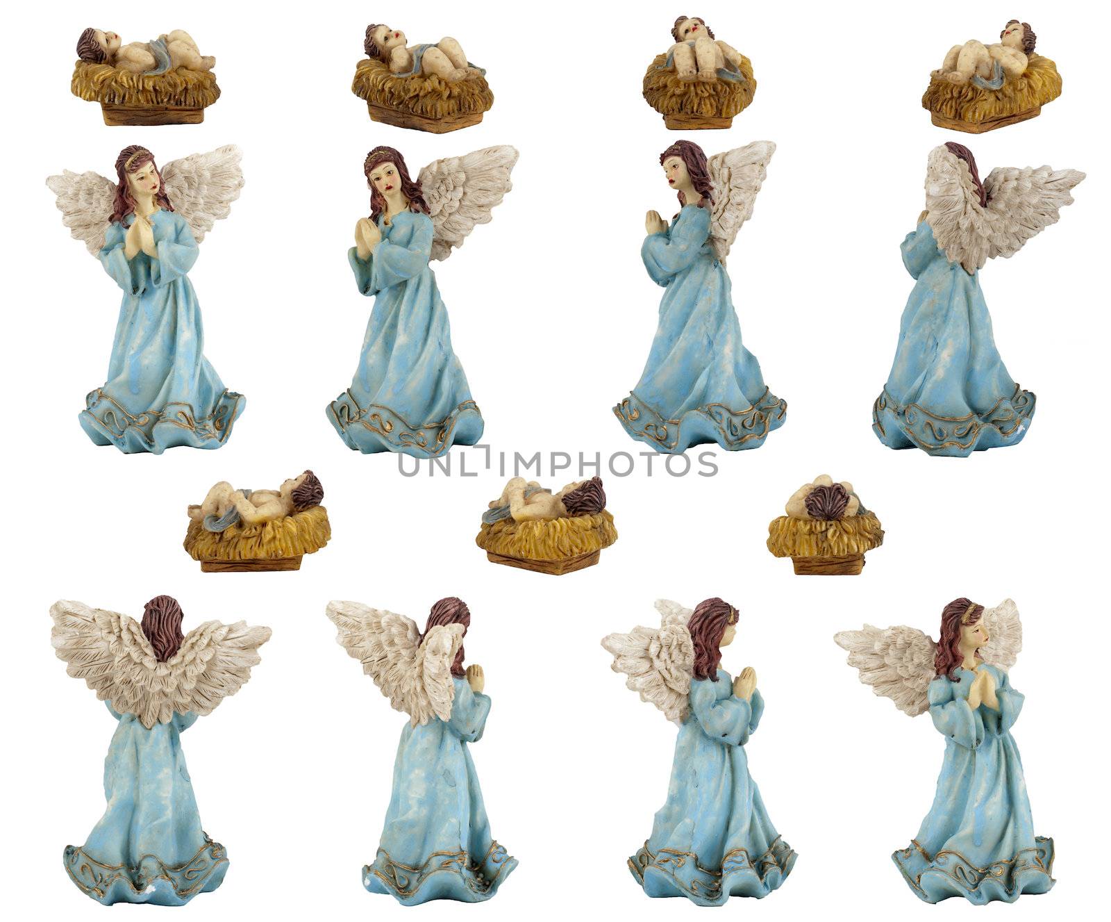 Christmas crib isolated on white statuettes representing Jesus and the Angel.