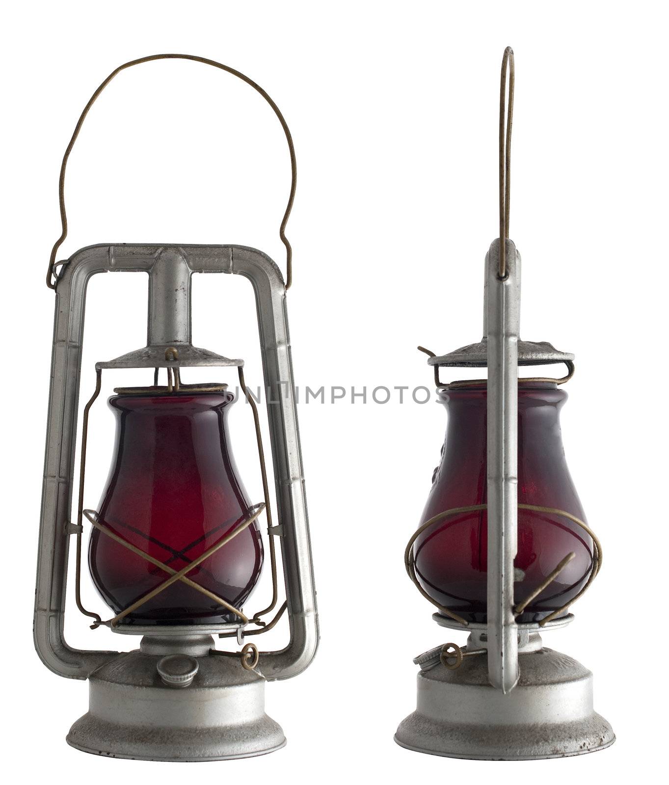 Old oil lamp isolated of the background and in diferent views.