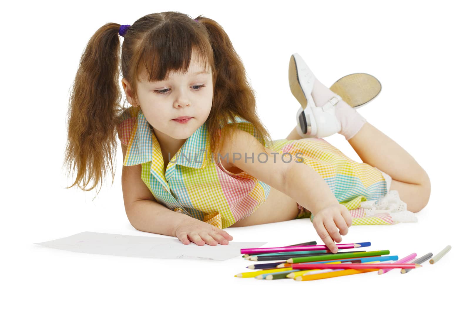 Little girl draws with crayons by pzaxe