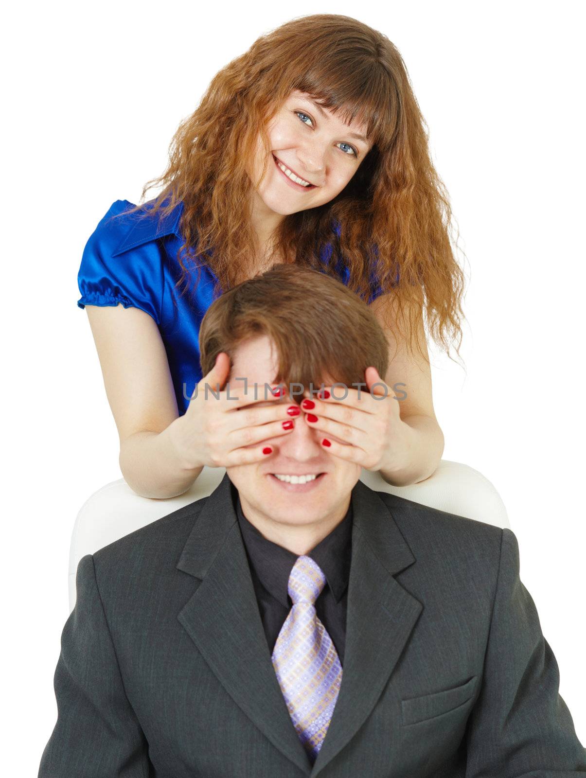 Playful woman covered eyes with a young man