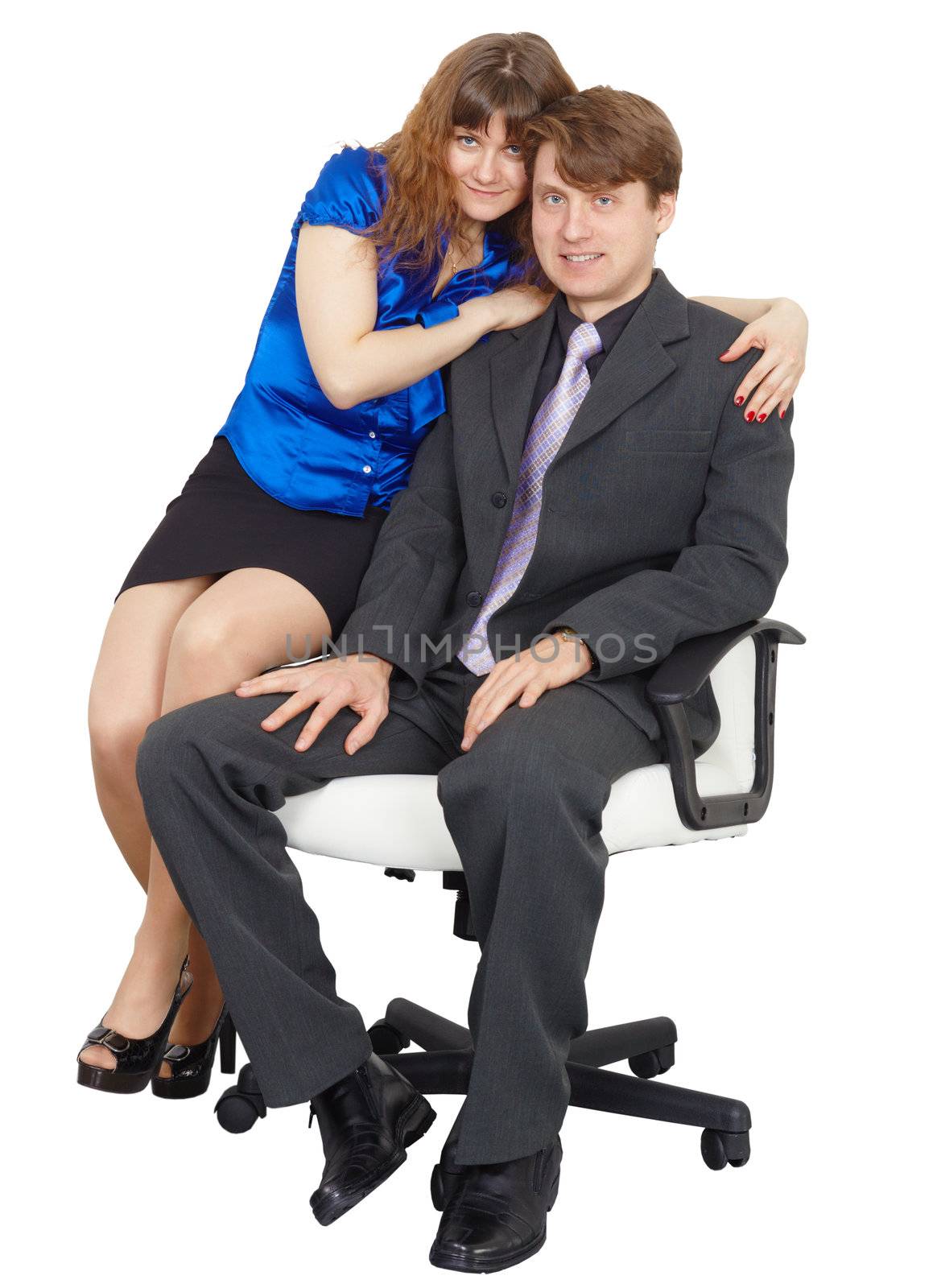 Young people - a man and a woman sitting on a chair on white