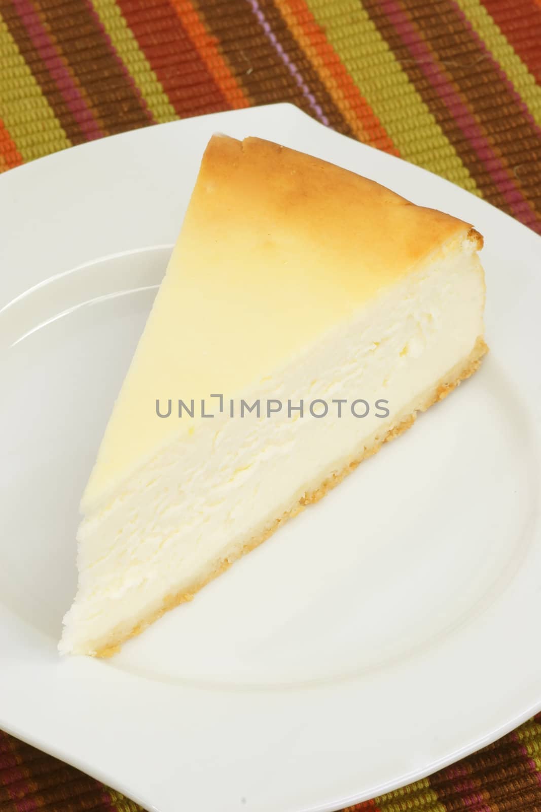 Slice of cheesecake on a kitchen plate