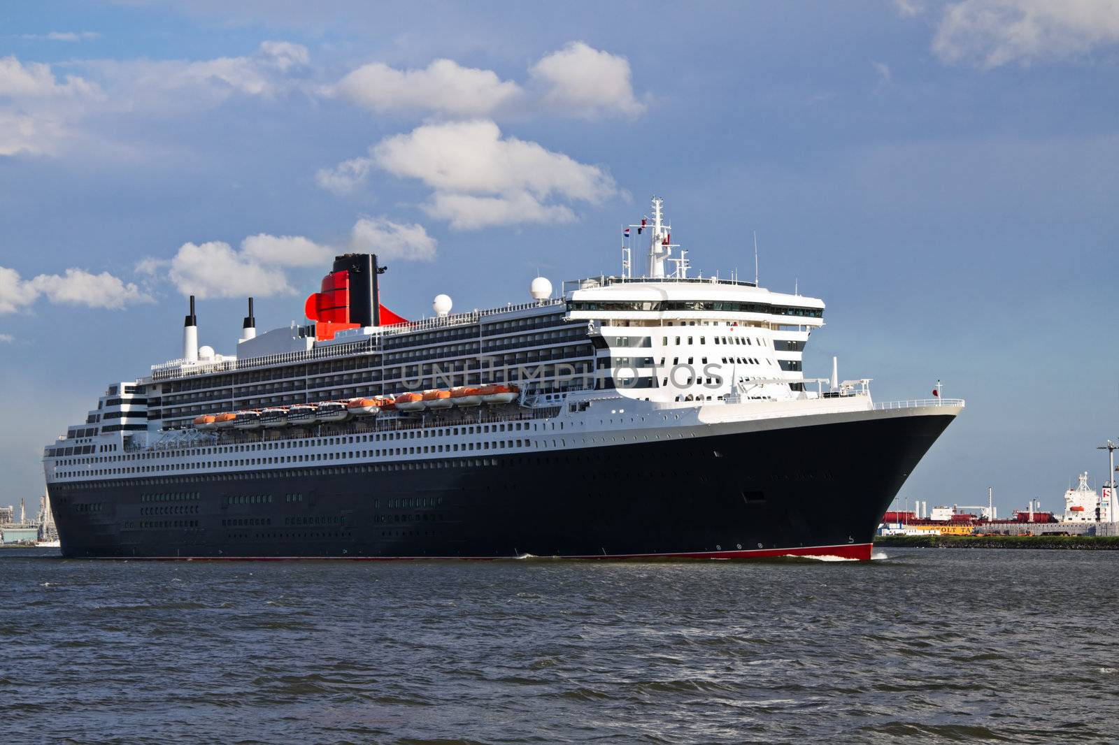 Cruise ship Queen Mary 2 sailing on the river when leaving Port of Rotterdam