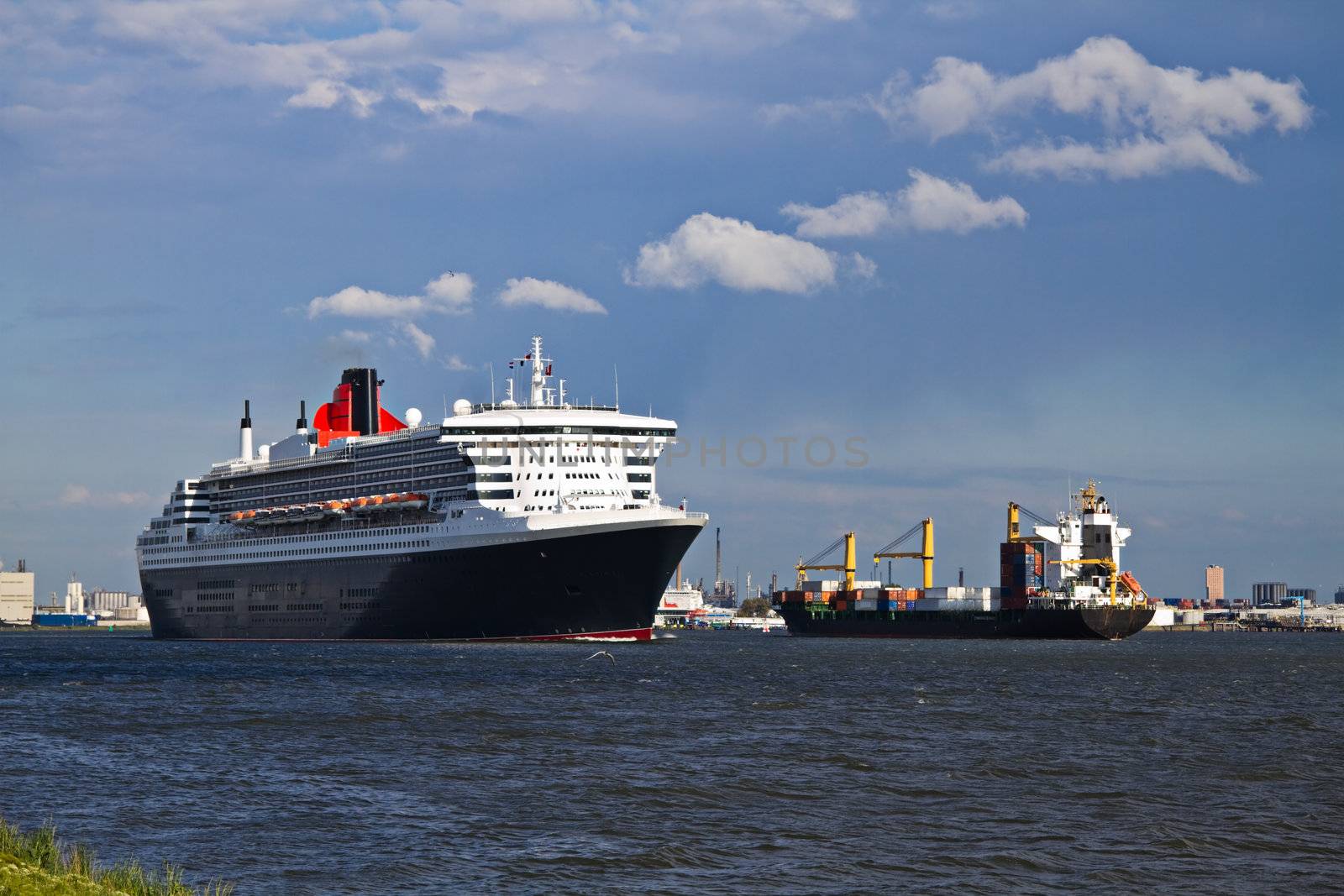 Cruise ship Queen Mary 2 sailing on the river when leaving Port of Rotterdam