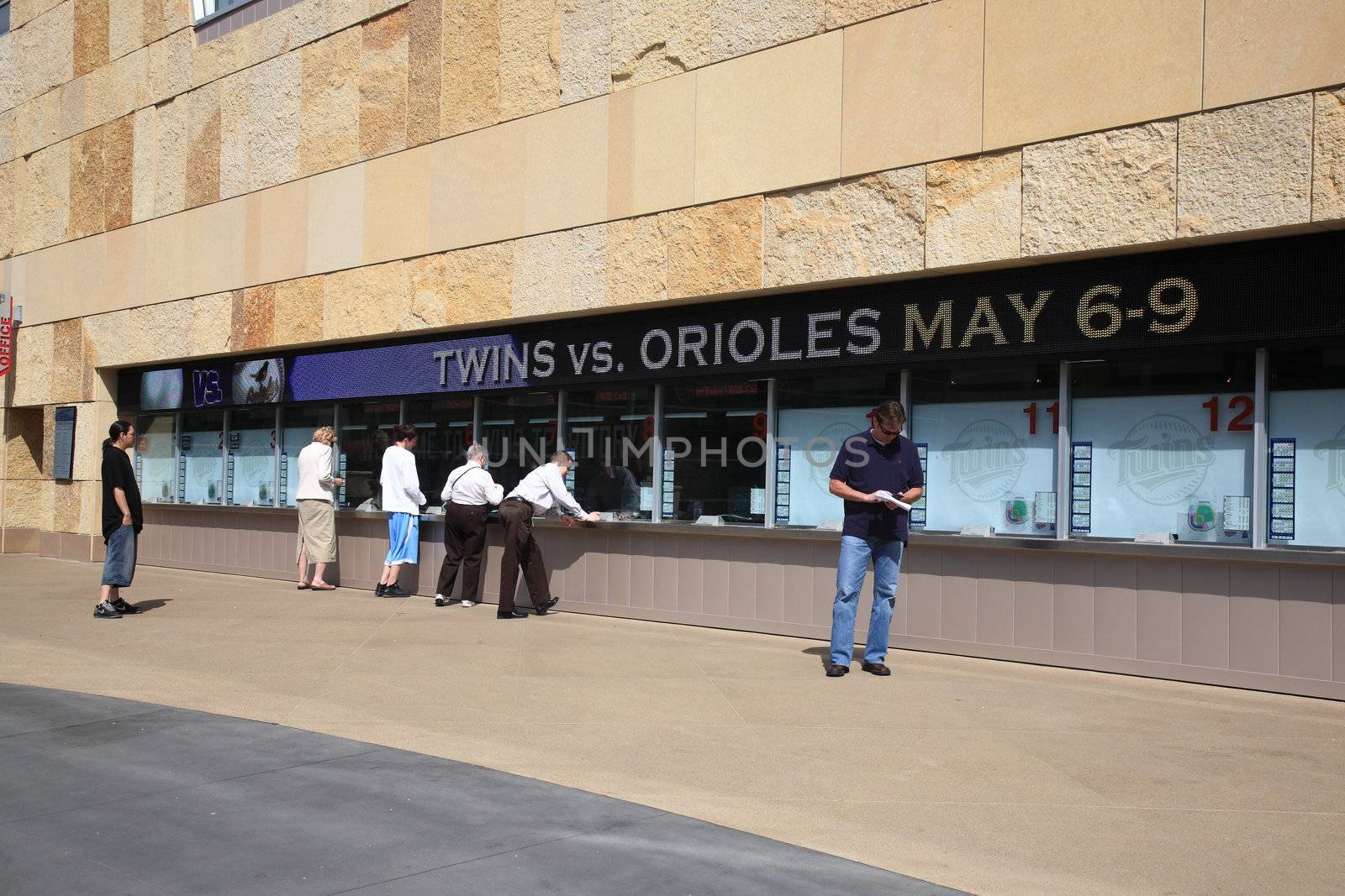 Fans line up at ticket booths for game against the Cleveland Indians at the new outdoor Twin Cities stadium
