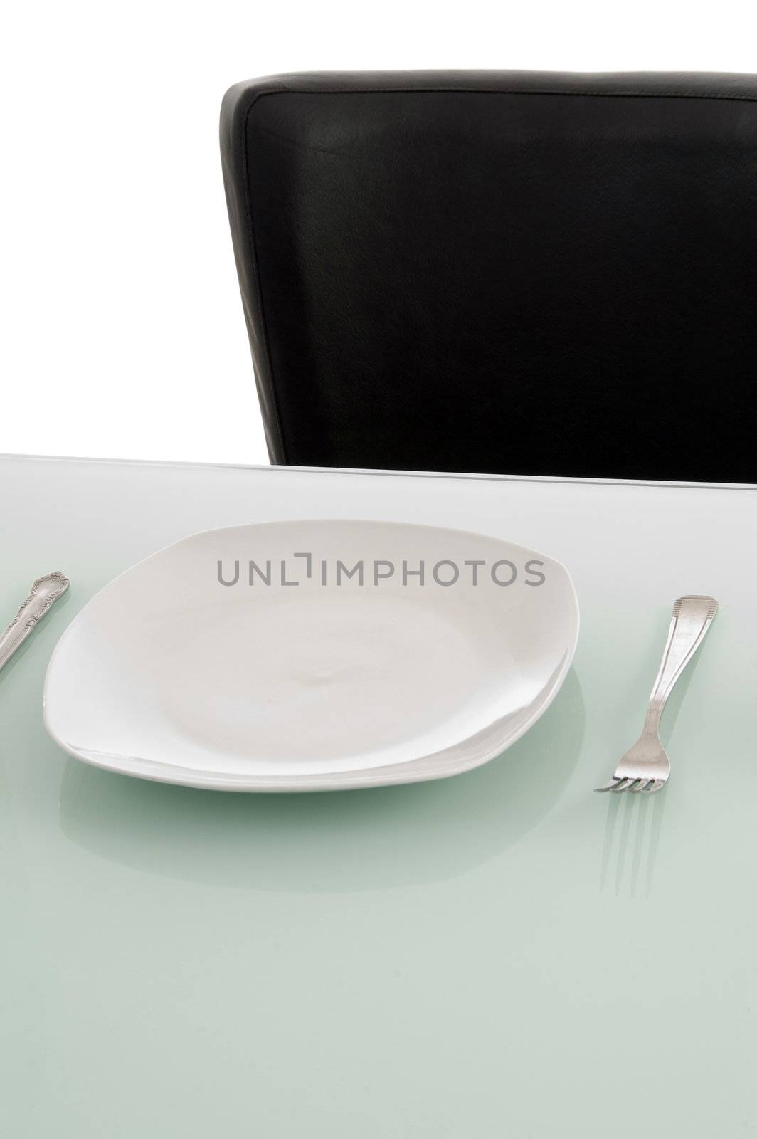 plates on dinning table by imagerymajestic