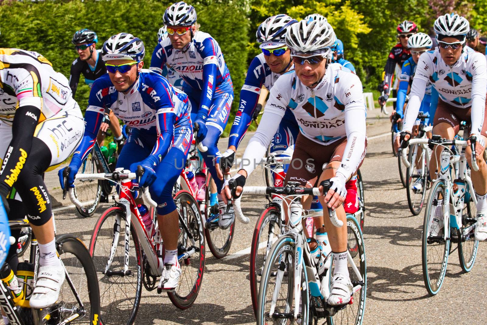 DELFGAUW, NETHERLANDS - MAY 10: Competitors and following teams in the Giro d�Italia passing by on a polderroad in the 3th stage of the competition on May 20, 2010, Delfgauw, the Netherlands. 