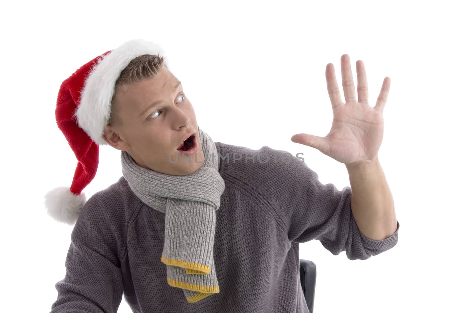 smiling young man with christmas hat showing five fingers on an isolated white background