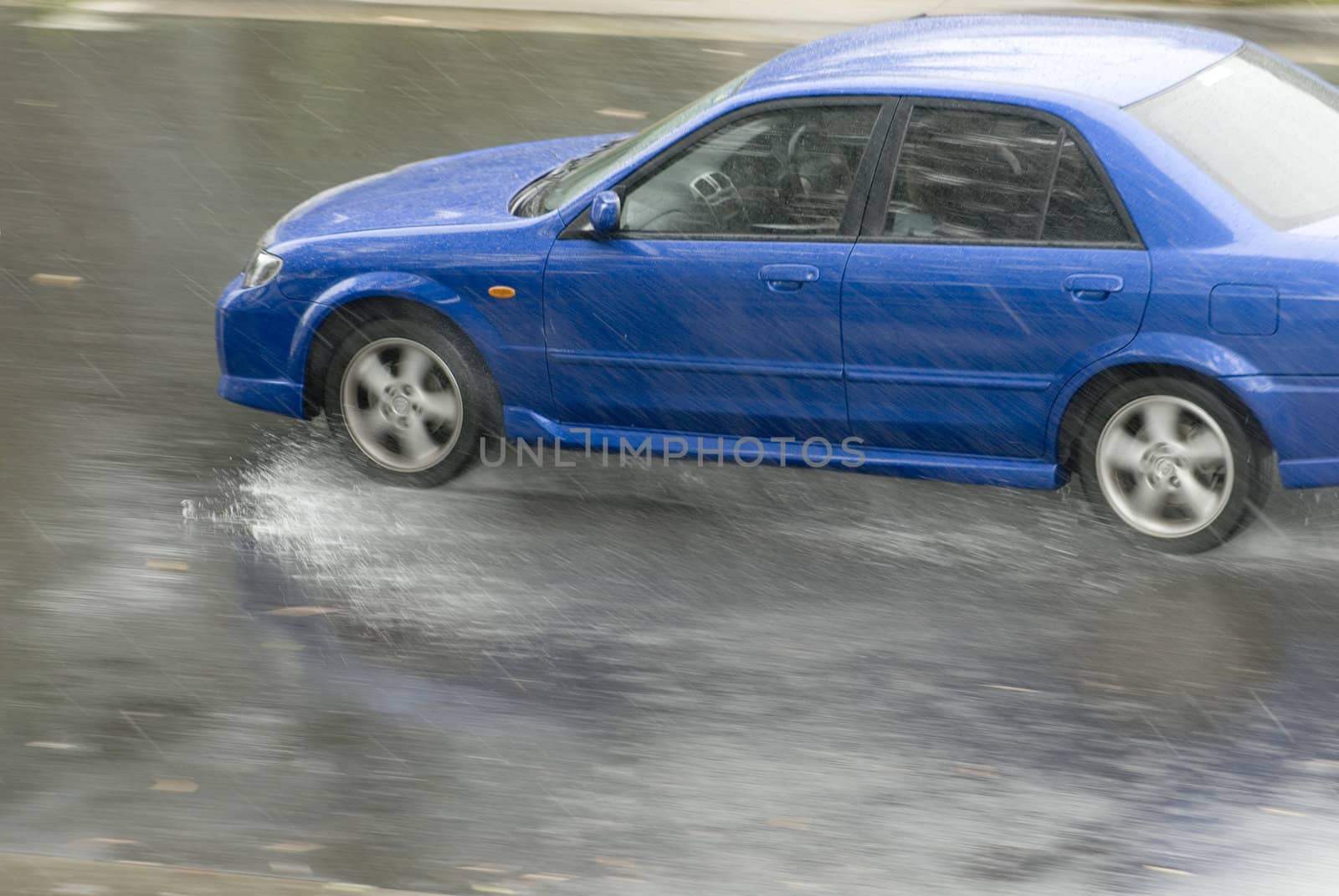 driving in dangerous conditions on a wet road