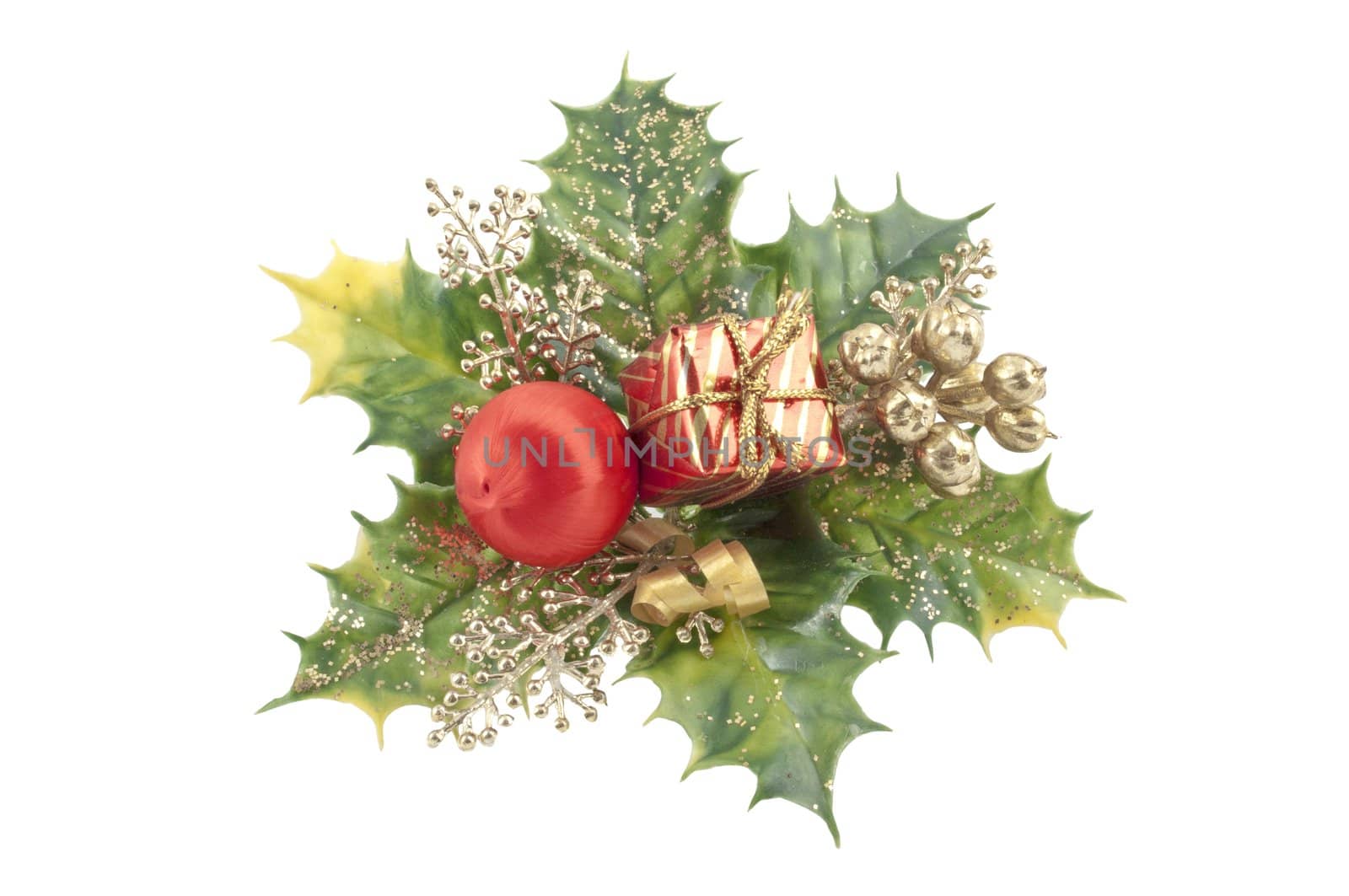 Holly leaves with red wrapped gift isolated on white