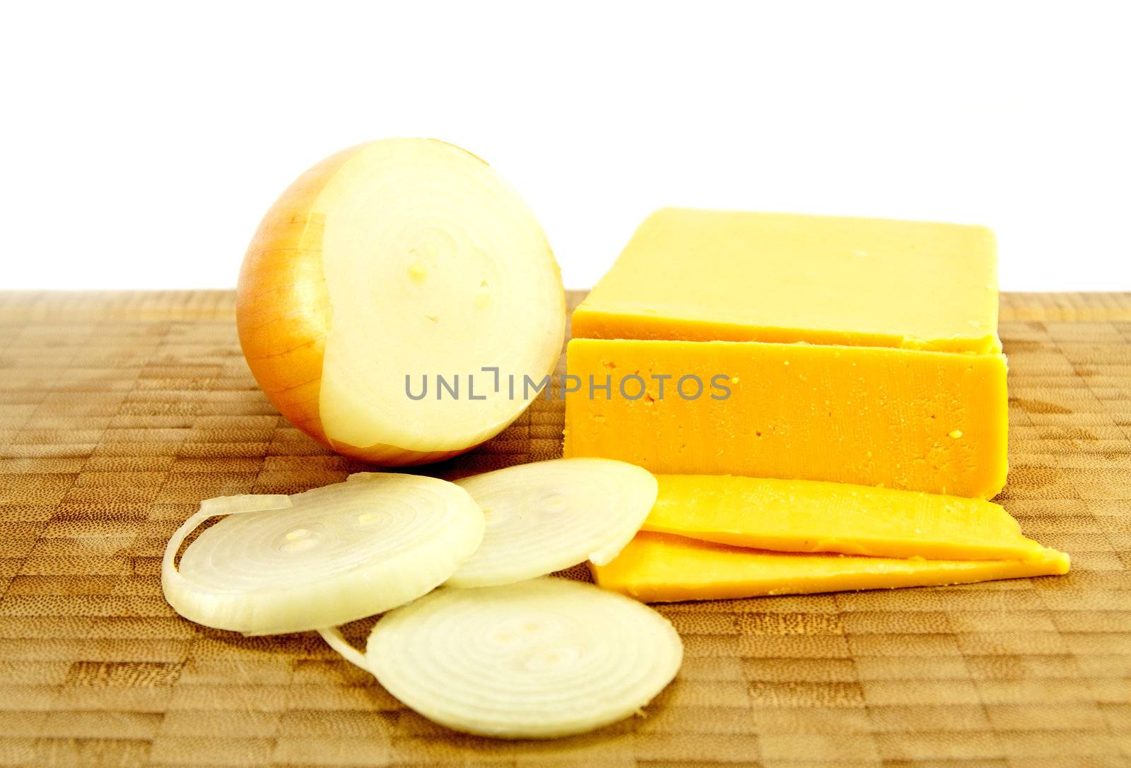 Sliced Cheese and Onion on a chopping board