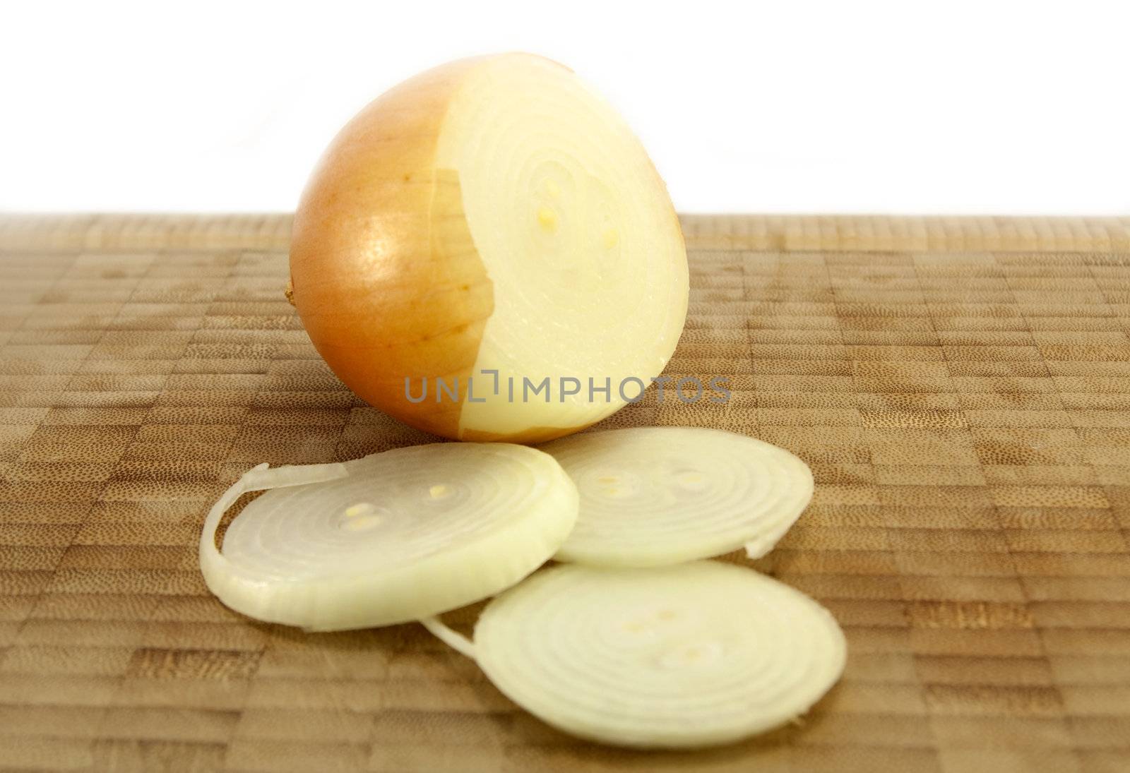 Sliced Onion on a wooden chopping board