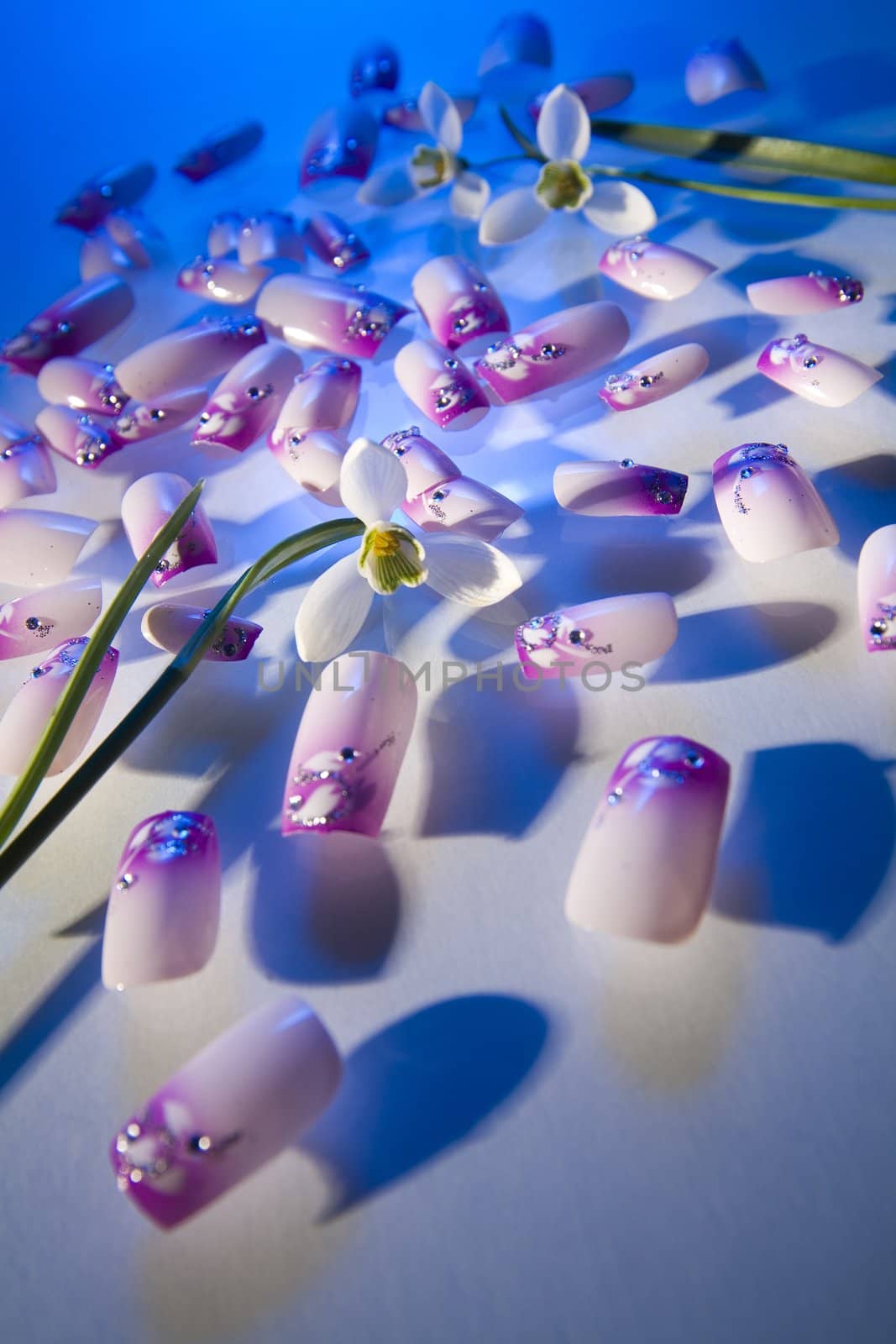 artificial nails on the table glass