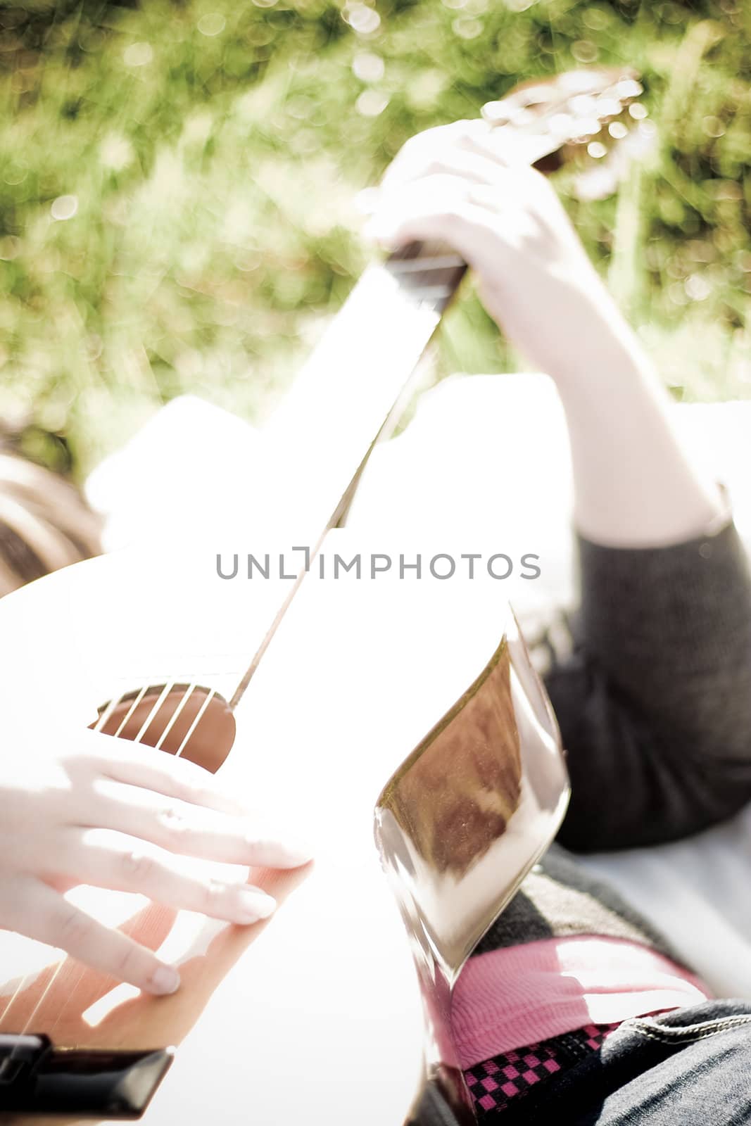 Girl Playing a Guitar by graficallyminded