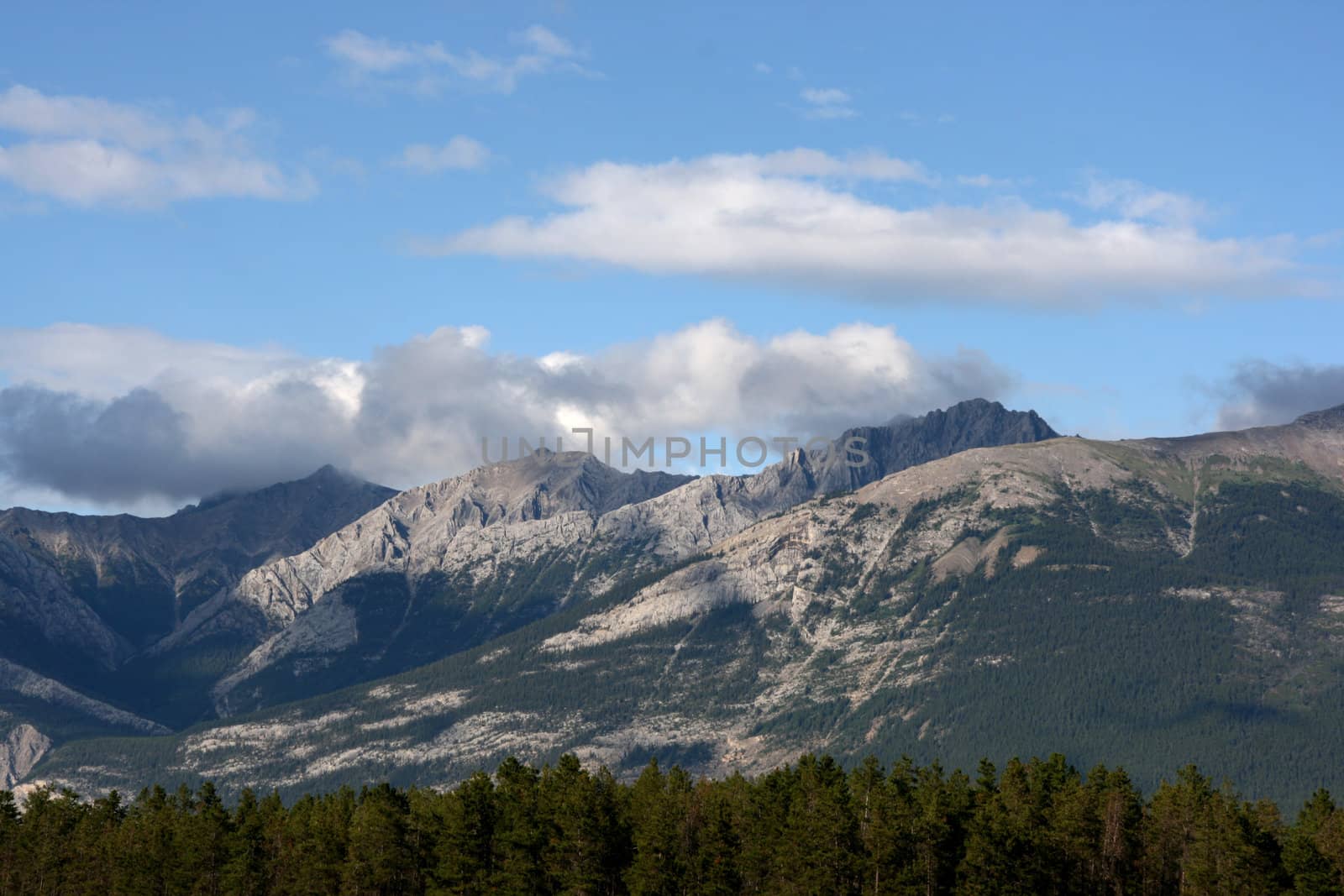 Clouds over mountains - beautiful vista in Jasper National Park, Canada.