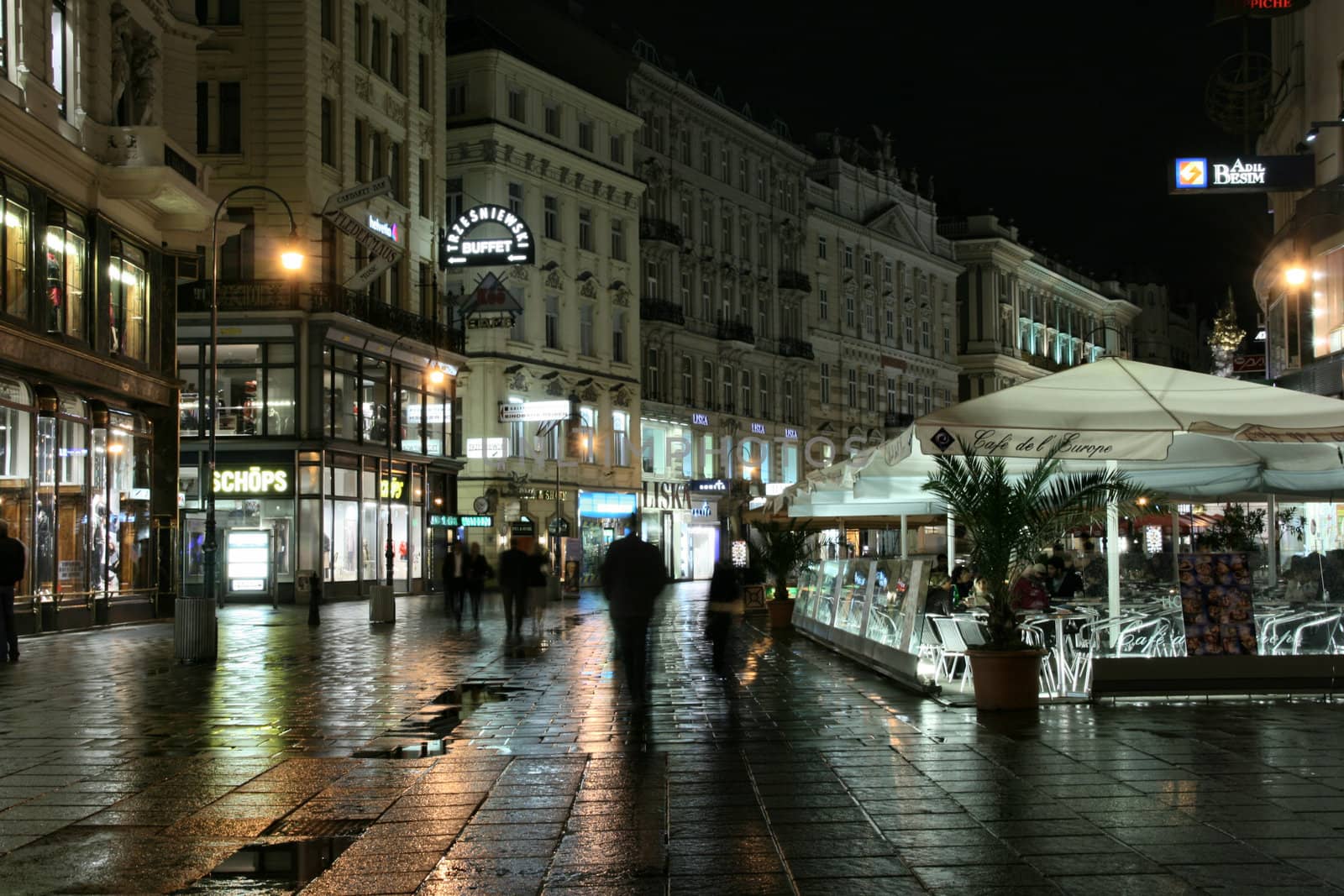 Vienna - famous Graben street at night with rain reflection on the cobbles