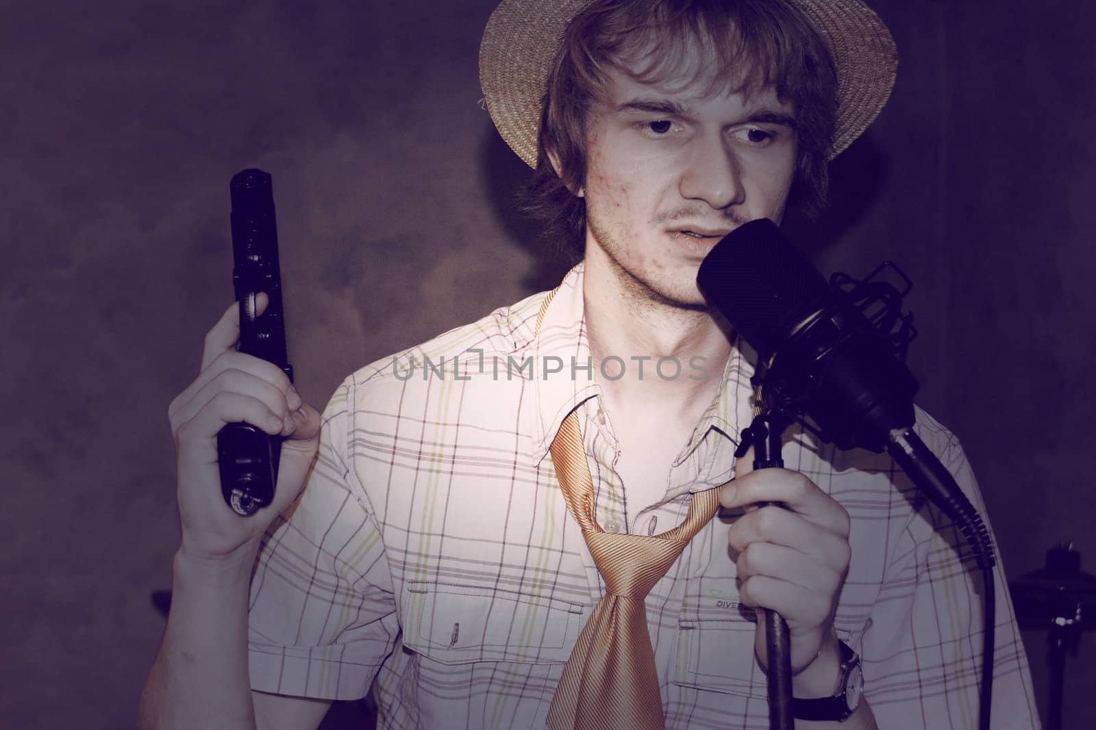 Young music man with gun