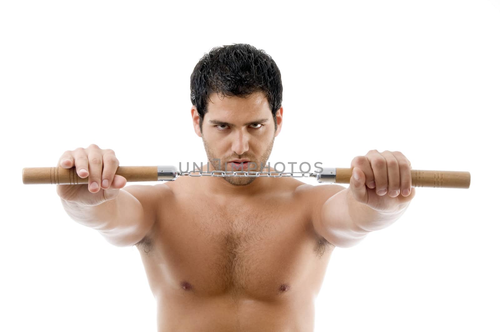 portrait of young man with nunchaku on an isolated background