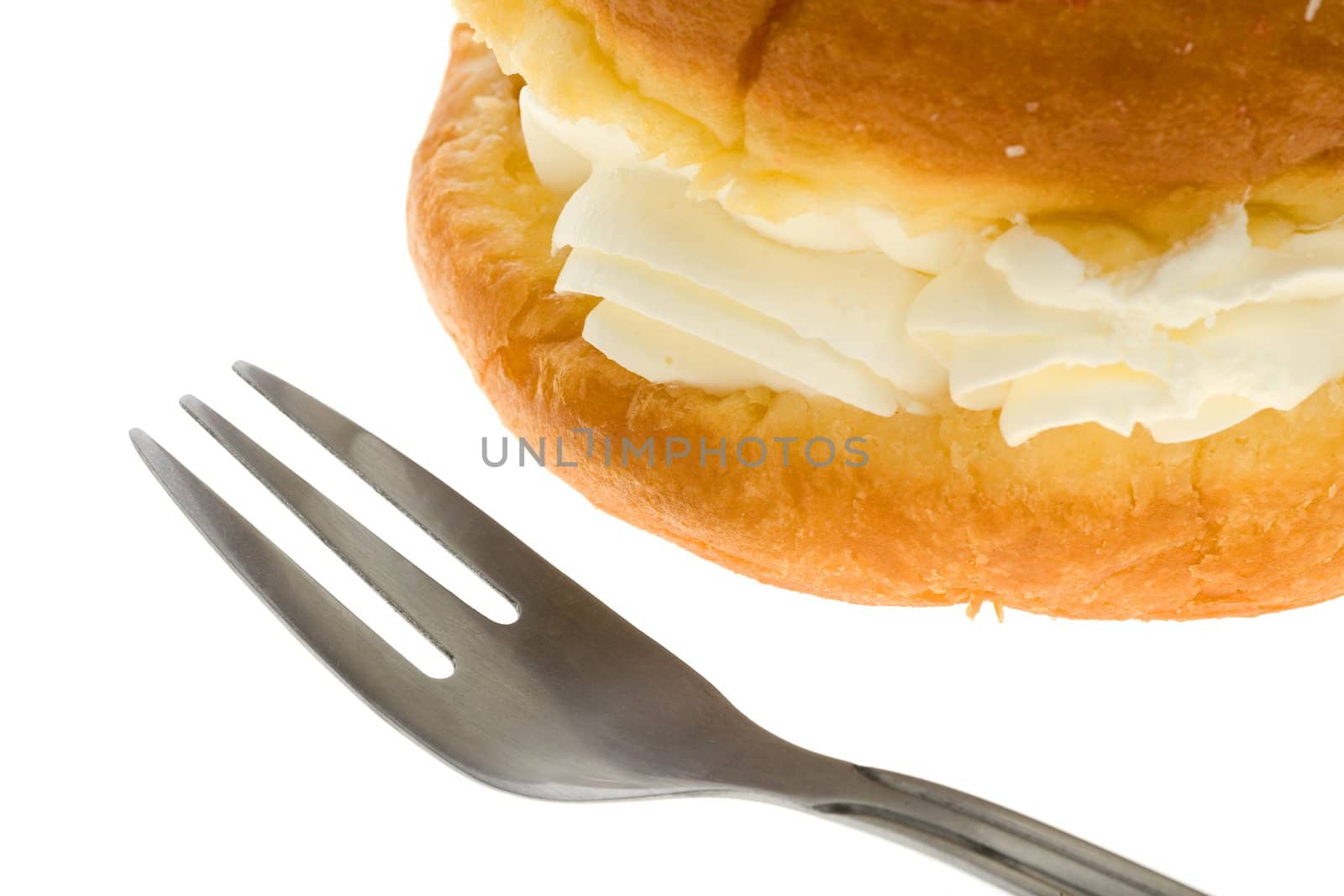 Puff cake with cream over white background