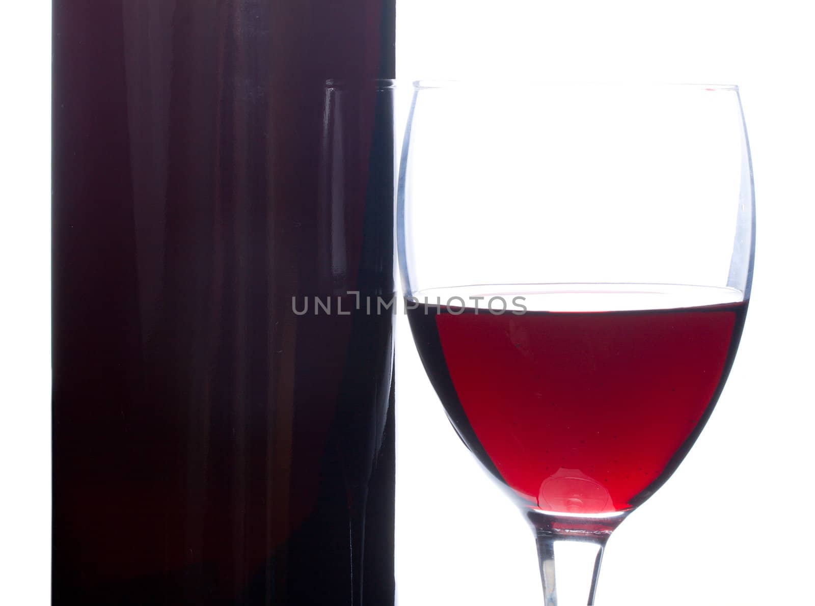 close-up wine in glass and bottle, isolated on white