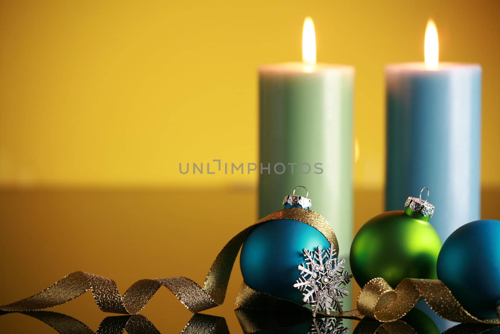 Christmas decorations on yellow background,focus on snowflake and gold ribbon