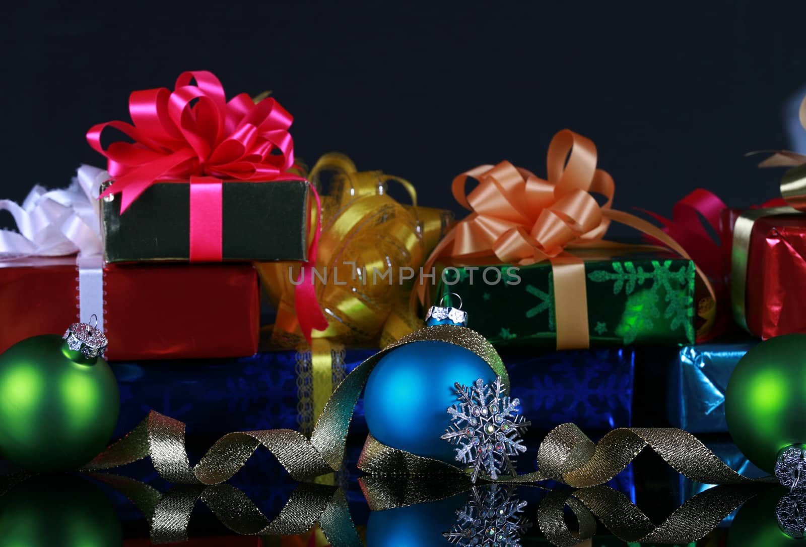 Christmas presents and decorations, focus on blue ball ,snowflake and gold ribbons
