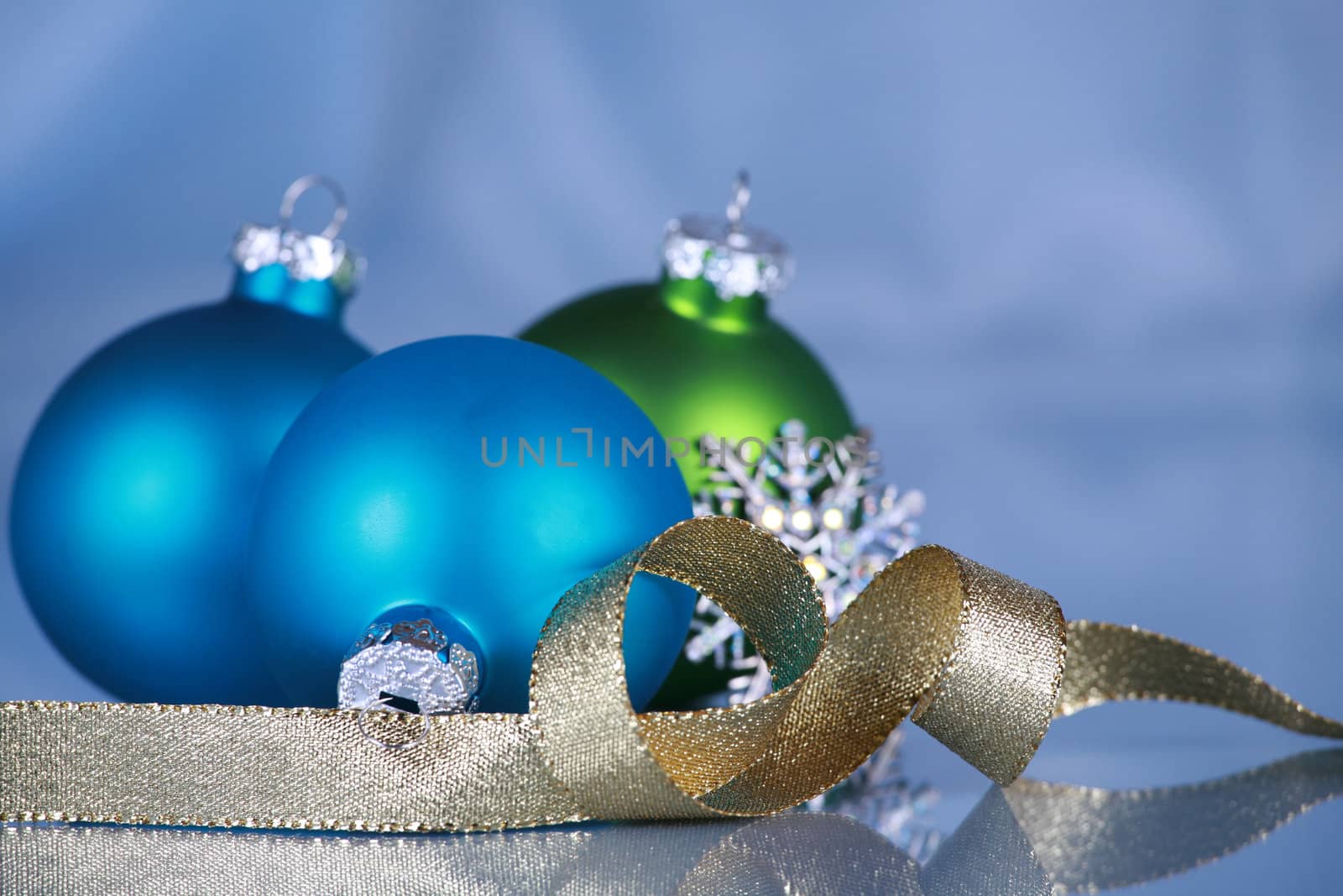 Christmas ornaments on soft blue cloth background