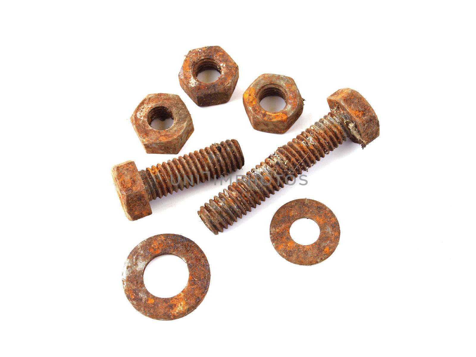 Rusty nuts and bolts on a plane white background.