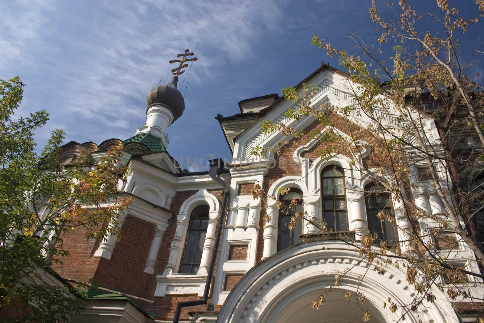 On a background of the light-blue sky church with domes.